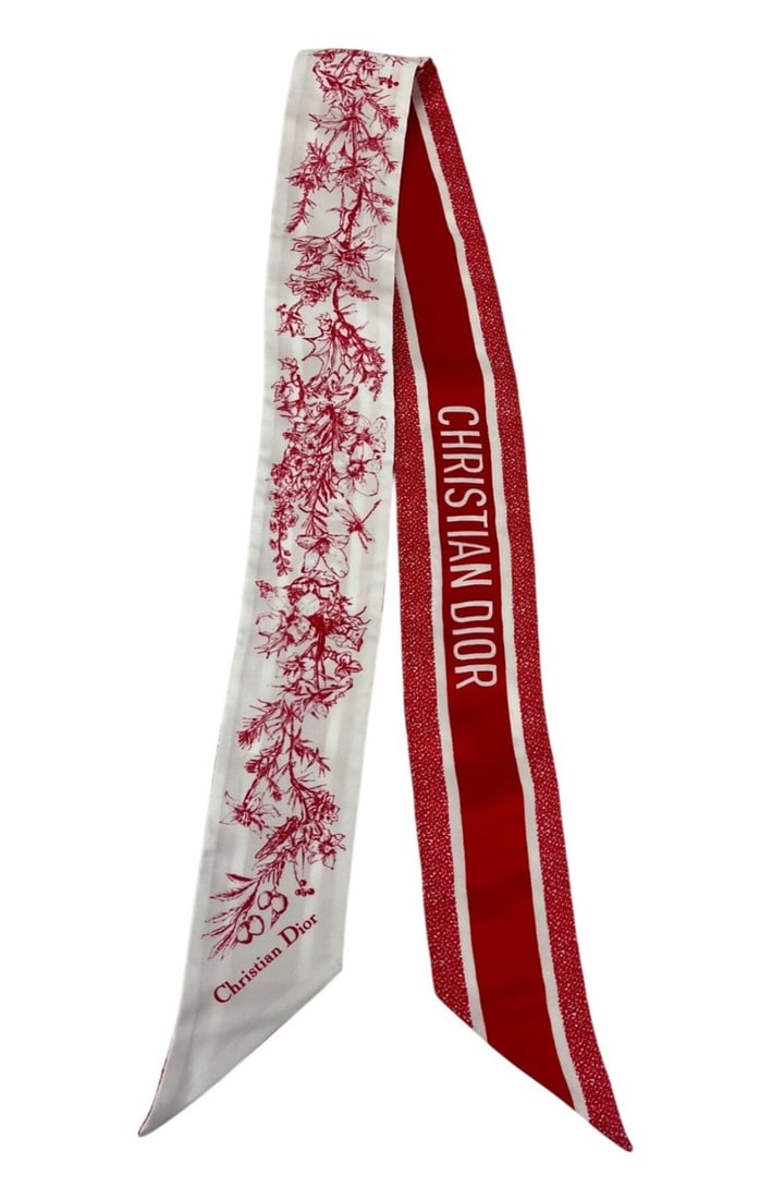 Toile de Jouy Sauvage Silk Twilly Scarf in Red and White: Toile de Jouy Sauvage Silk Twilly Scarf in Red and White This Christian Dior Toile De Jouy Sauvage Mitzah twilly scarf features a vibrant red and white floral pattern on luxurious silk. Designed for w