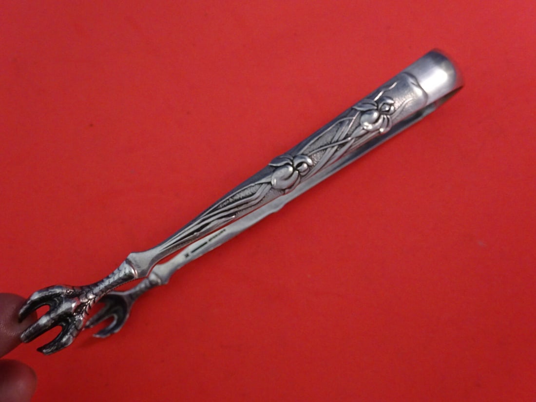 Tiffany & Co Vine Pattern Sterling Silver Sugar Tong Monogram F 5": Tiffany & Co Vine Pattern Sterling Silver Sugar Tong Monogram F 5" This exquisite sugar tong from Tiffany & Co. belongs to the iconic Vine pattern, showcasing a beautiful design with iris claw tines.