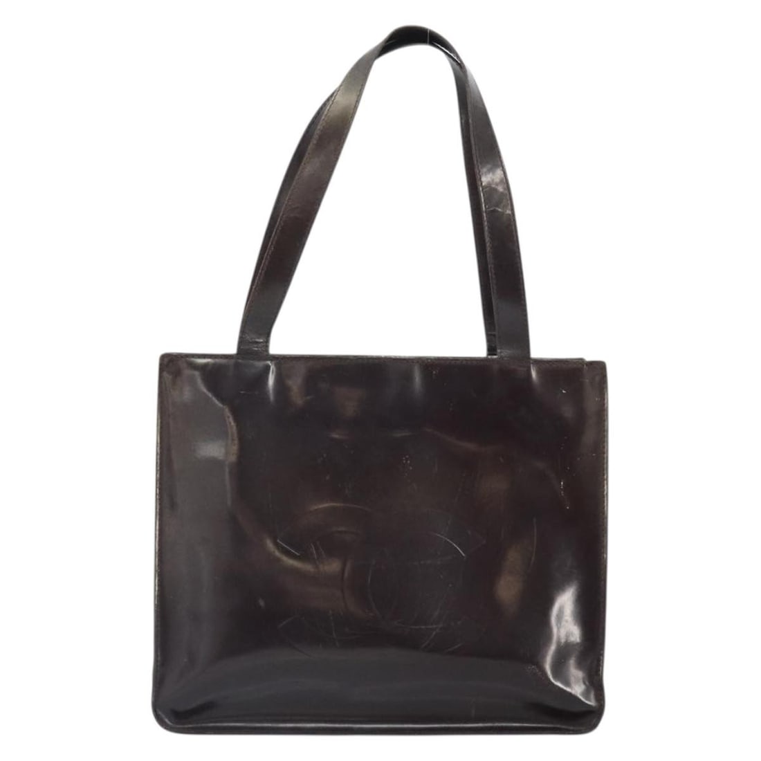 Chanel Brown Patent Leather Vintage Tote 29cm by 22cm by 9cm: Chanel Brown Patent Leather Vintage Tote 29cm by 22cm by 9cm This Chanel vintage tote for women is crafted from brown patent leather and features a structured design. The bag shows signs of wear inclu