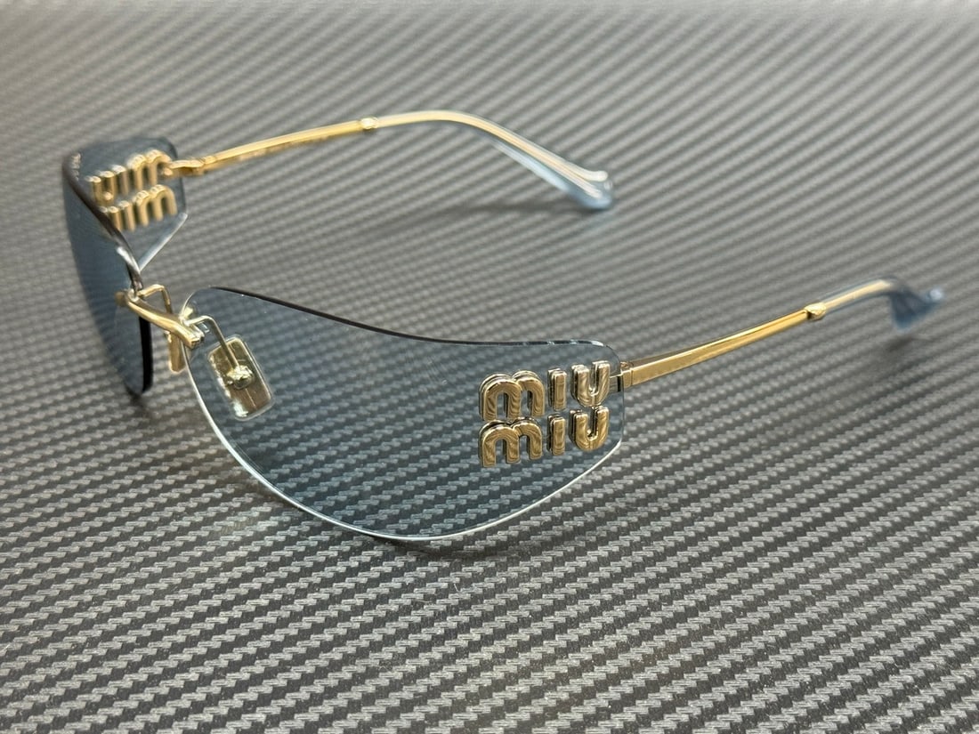 Miu Miu MU A51S ZVN10P Gold Frame Blue Lenses Women's Sunglasses: Miu Miu MU A51S ZVN10P Gold Frame Blue Lenses Women's Sunglasses Elevate your style with these Miu Miu MU A51S ZVN10P sunglasses, featuring a luxurious gold frame that complements the striking blue le