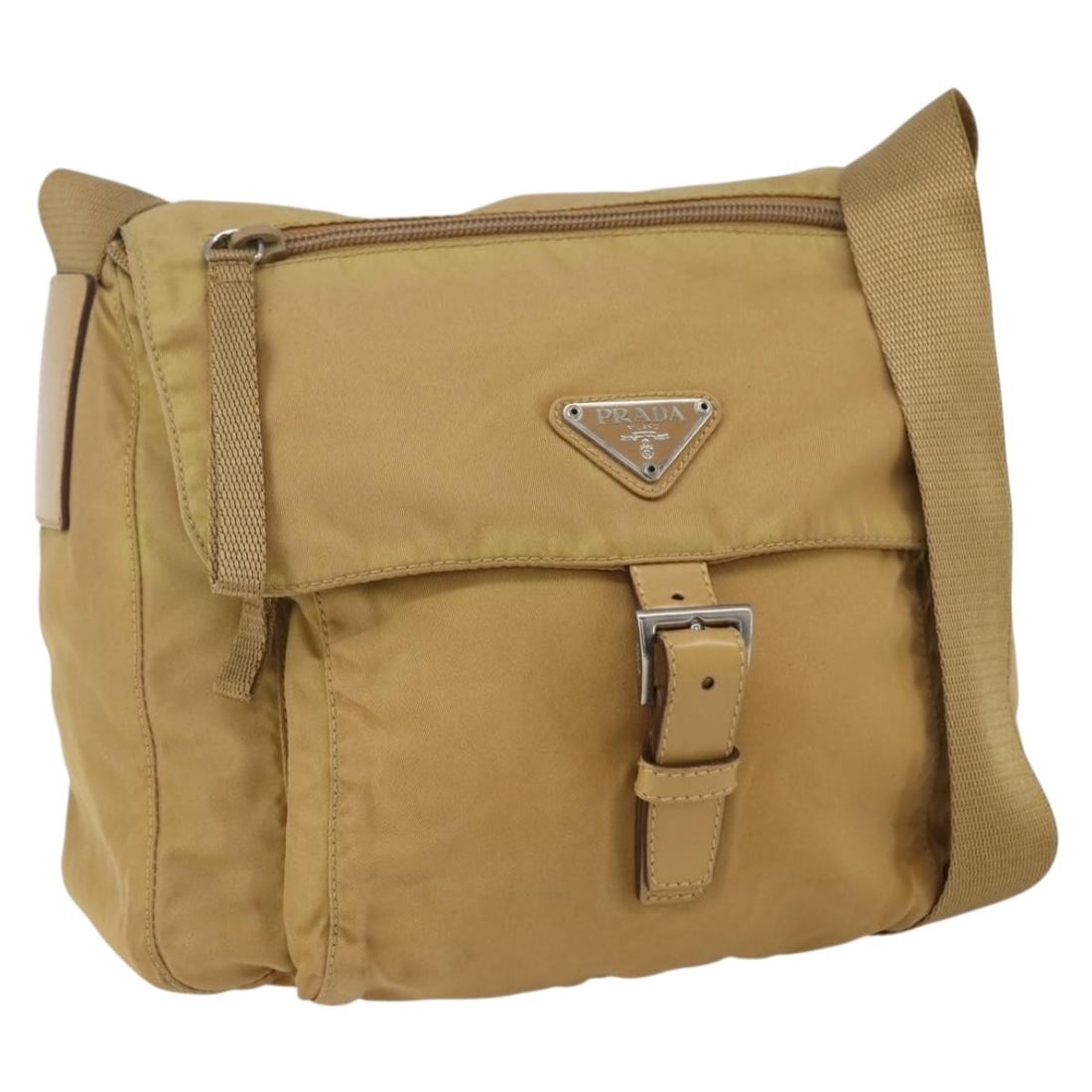 Prada Tessuto Nylon Beige Messenger Bag 24cm by 20cm by 10cm: Prada Tessuto Nylon Beige Messenger Bag 24cm by 20cm by 10cm This pre-owned Prada Buckle Messenger Bag for women features a beige nylon exterior with a compact design. It shows minor signs of use, inc