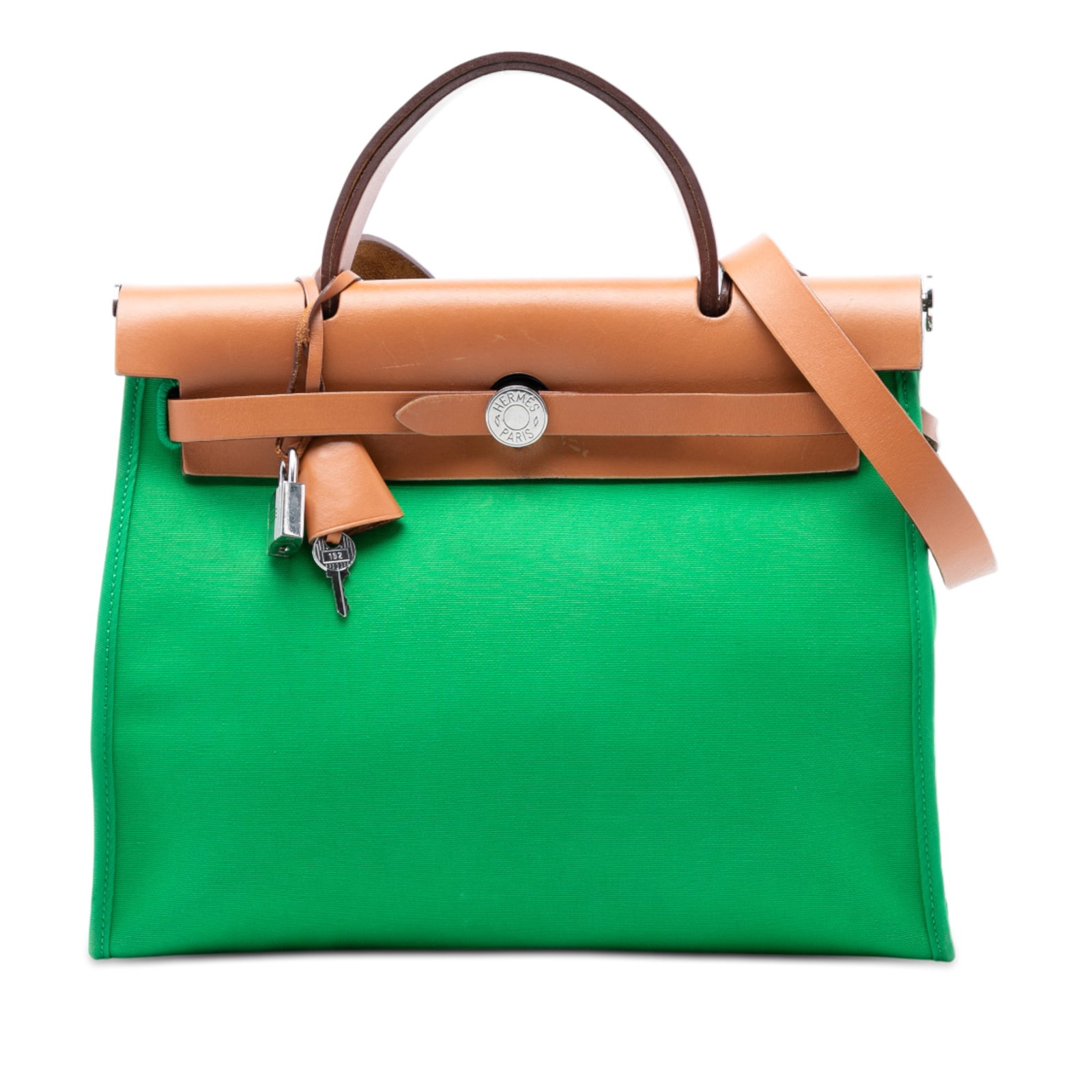 Herbag Zip 31 Green Canvas Satchel with Leather Handle by Hermes: Herbag Zip 31 Green Canvas Satchel with Leather Handle by Hermes The Hermes Toile Herbag Zip 31 is a satchel featuring a green canvas body, a clochette, a flat leather top handle, and a flat leather s