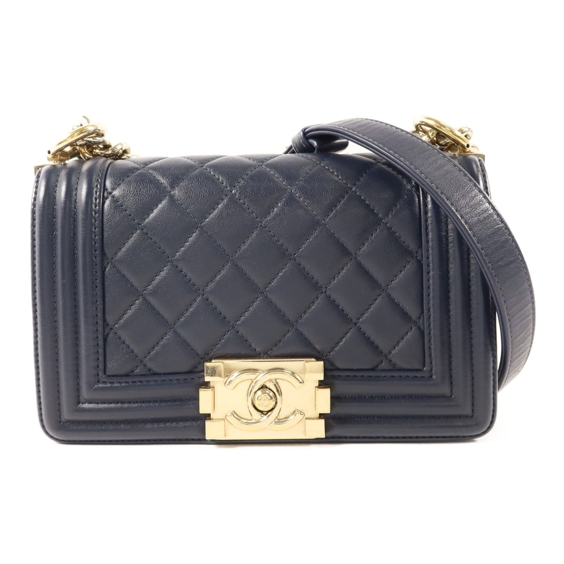 Chanel Boy 20 Navy Lambskin Shoulder Bag with Gold Tone CC Chain: Chanel Boy 20 Navy Lambskin Shoulder Bag with Gold Tone CC Chain This CHANEL Boy 20 chain shoulder bag features a classic navy lambskin leather exterior with signature CC detailing and gold hardware. 