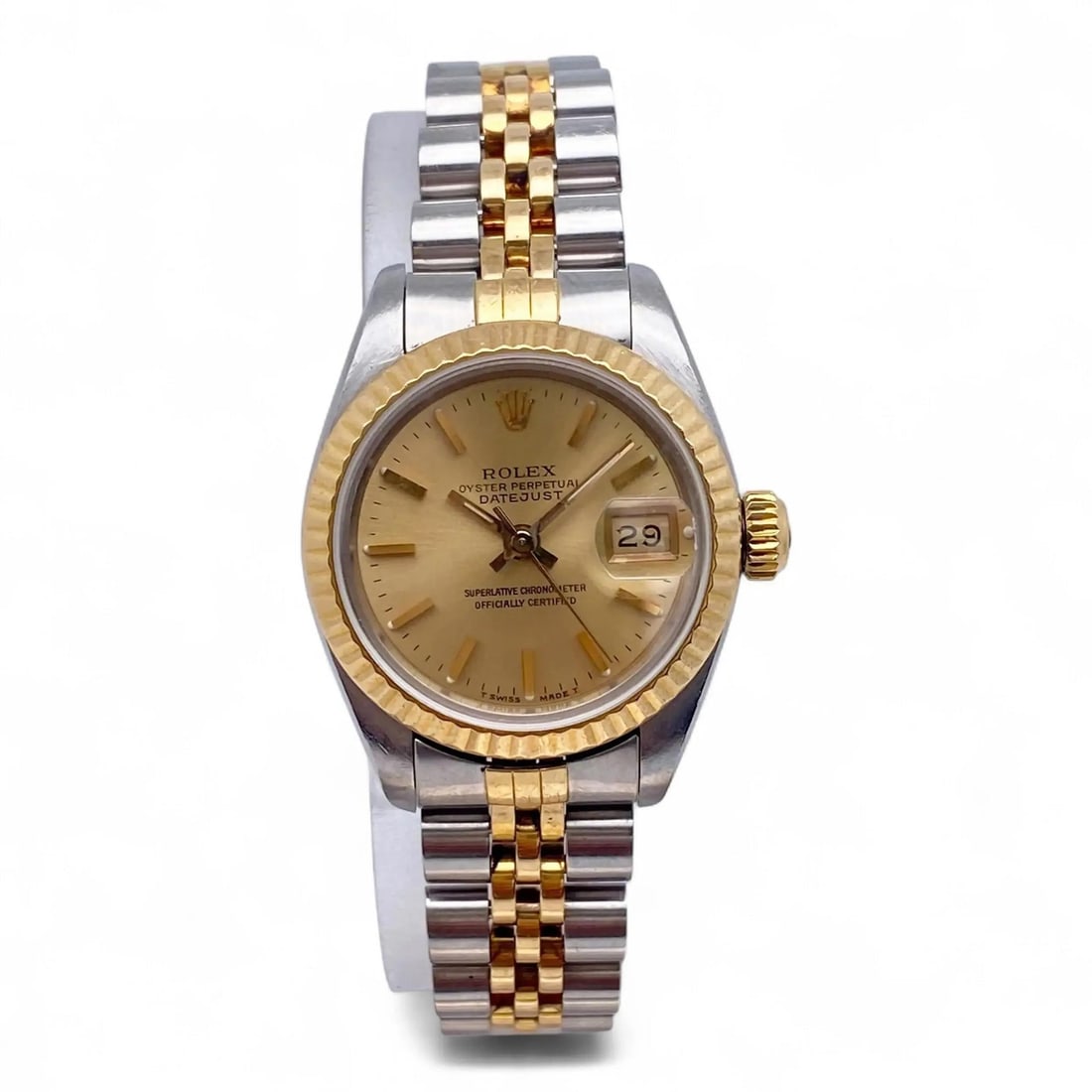 Ladies 26mm Datejust Sunburst Dial Automatic Watch Champagne Stick Markers: Ladies 26mm Datejust Sunburst Dial Automatic Watch Champagne Stick Markers This pre-owned Rolex Datejust Ladies Watch features a 26 mm polished stainless steel case with a fluted fixed yellow gold bez