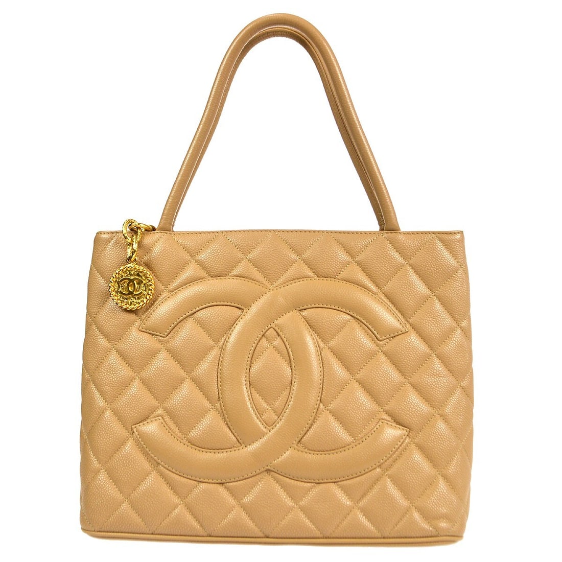 Chanel Beige Caviar Skin Medallion Quilted Tote Handbag: Chanel Beige Caviar Skin Medallion Quilted Tote Handbag This Chanel Beige Calfskin Medallion Quilted Tote Handbag is a stylish accessory perfect for casual occasions. Crafted from luxurious caviar ski