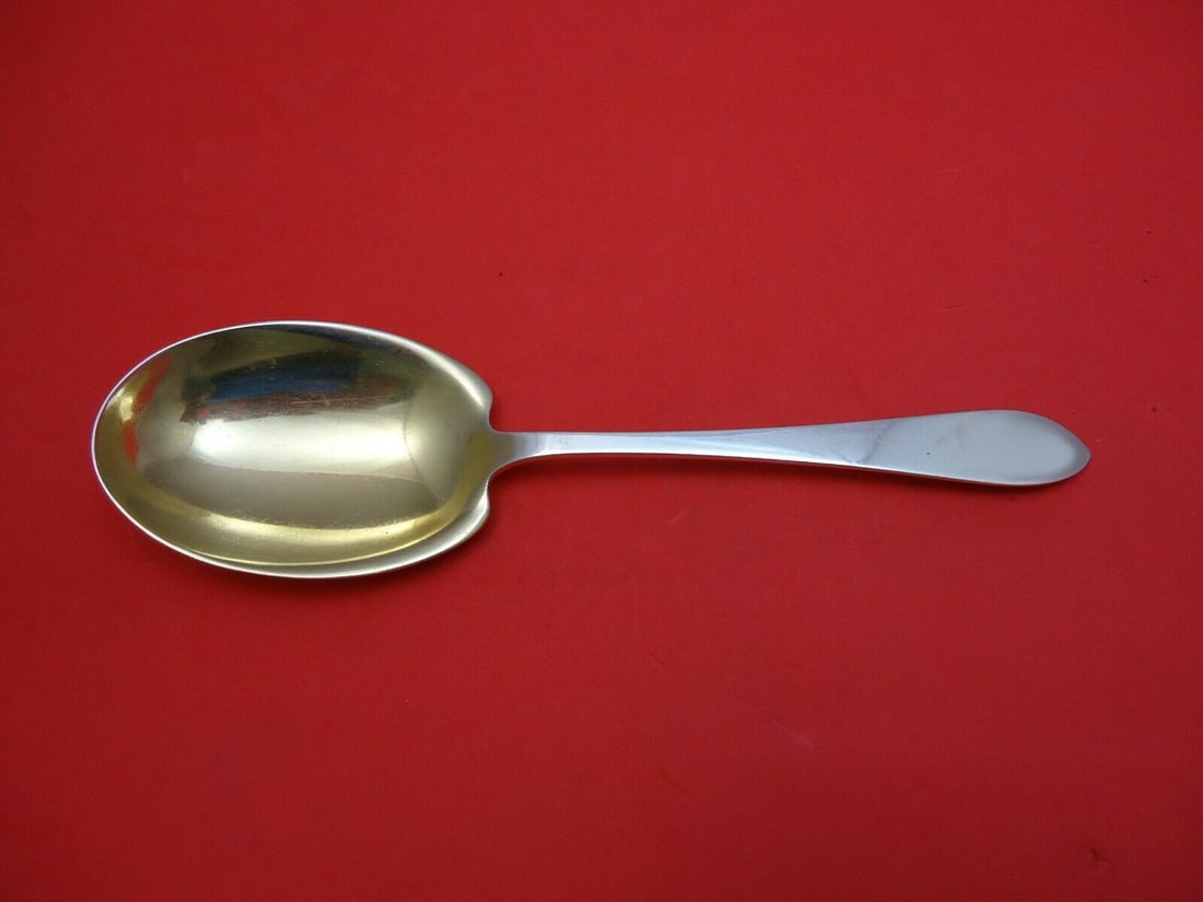 Tiffany & Co Faneuil Sterling Silver Berry Spoon Gold Wash 9": Tiffany & Co Faneuil Sterling Silver Berry Spoon Gold Wash 9" Discover the elegance of the Faneuil pattern by Tiffany & Co. This exquisite berry spoon, crafted from sterling silver and featuring a gol