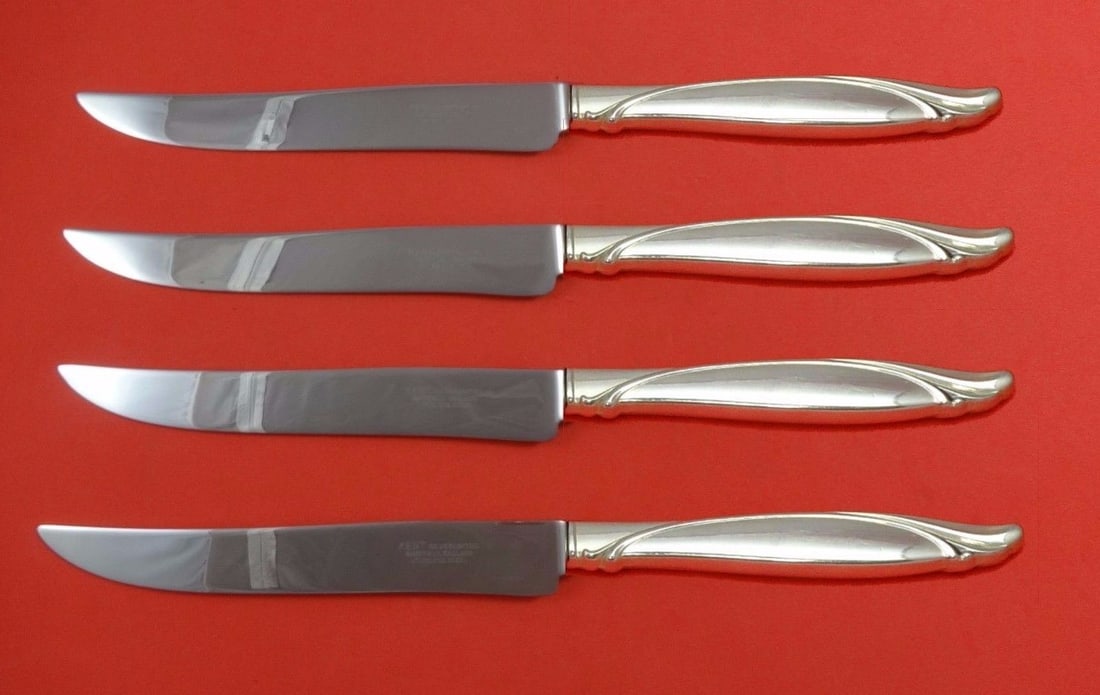 Oneida Sentimental Sterling Silver Steak Knife Set 4pc Texas Size: Oneida Sentimental Sterling Silver Steak Knife Set 4pc Texas Size Elevate your dining experience with this striking 4-piece steak knife set from Oneida's Sentimental pattern. Crafted from sterling sil