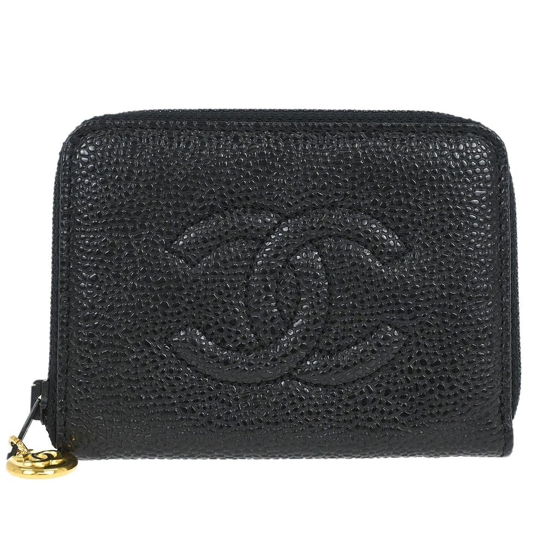 Black Leather Key Holder by Chanel with Logo Accent: Black Leather Key Holder by Chanel with Logo Accent This vintage Chanel key case is crafted from black leather and features a logo zipper accent. Made in Italy, it offers a compact and stylish solutio