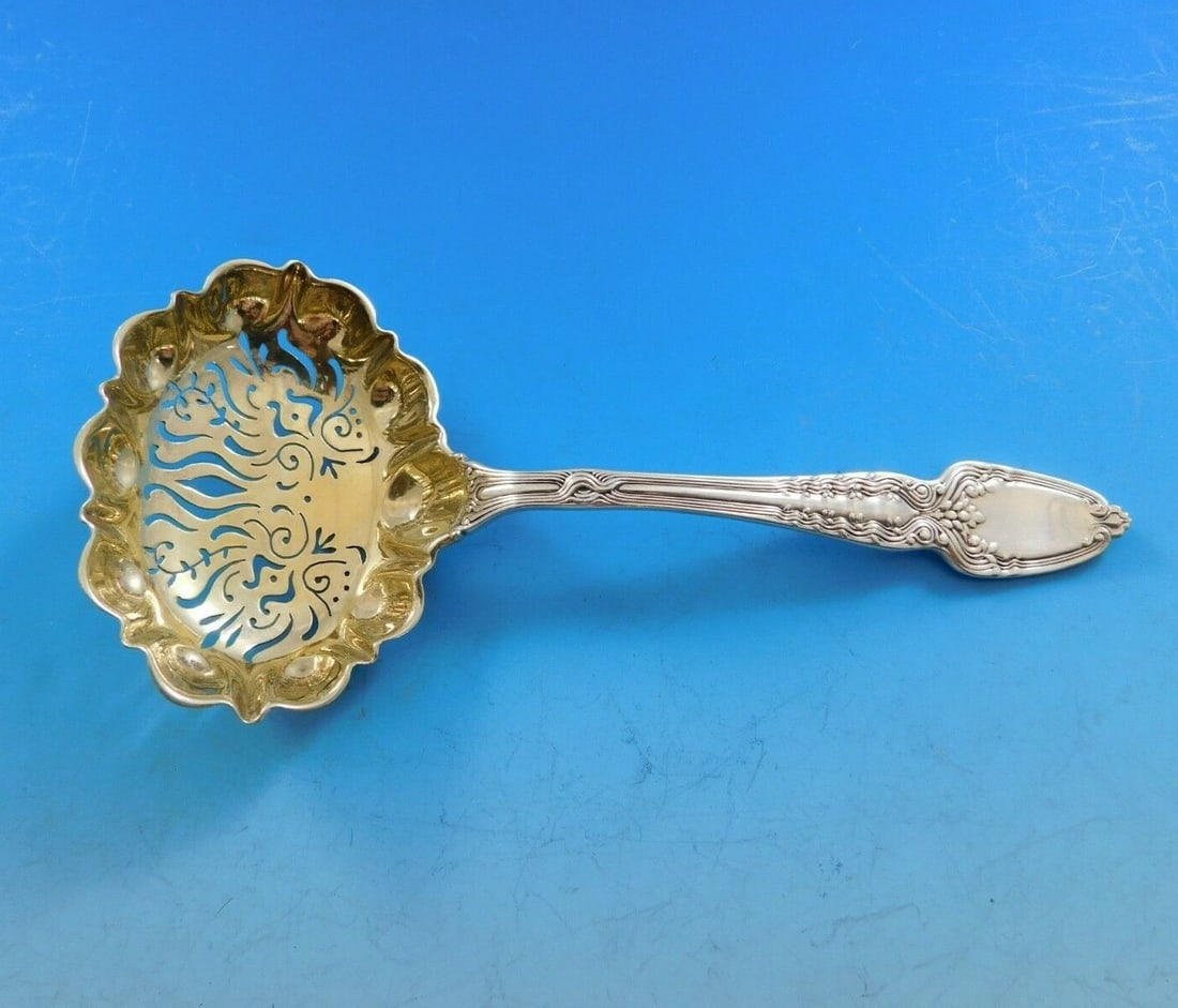 Tiffany & Co. Broom Corn Sterling Silver Sugar Sifter 5 3/4" Goldwash: Tiffany & Co. Broom Corn Sterling Silver Sugar Sifter 5 3/4" Goldwash This exquisite sugar sifter is a stunning piece from Tiffany & Co., crafted from sterling silver in the elegant Broom Corn pattern