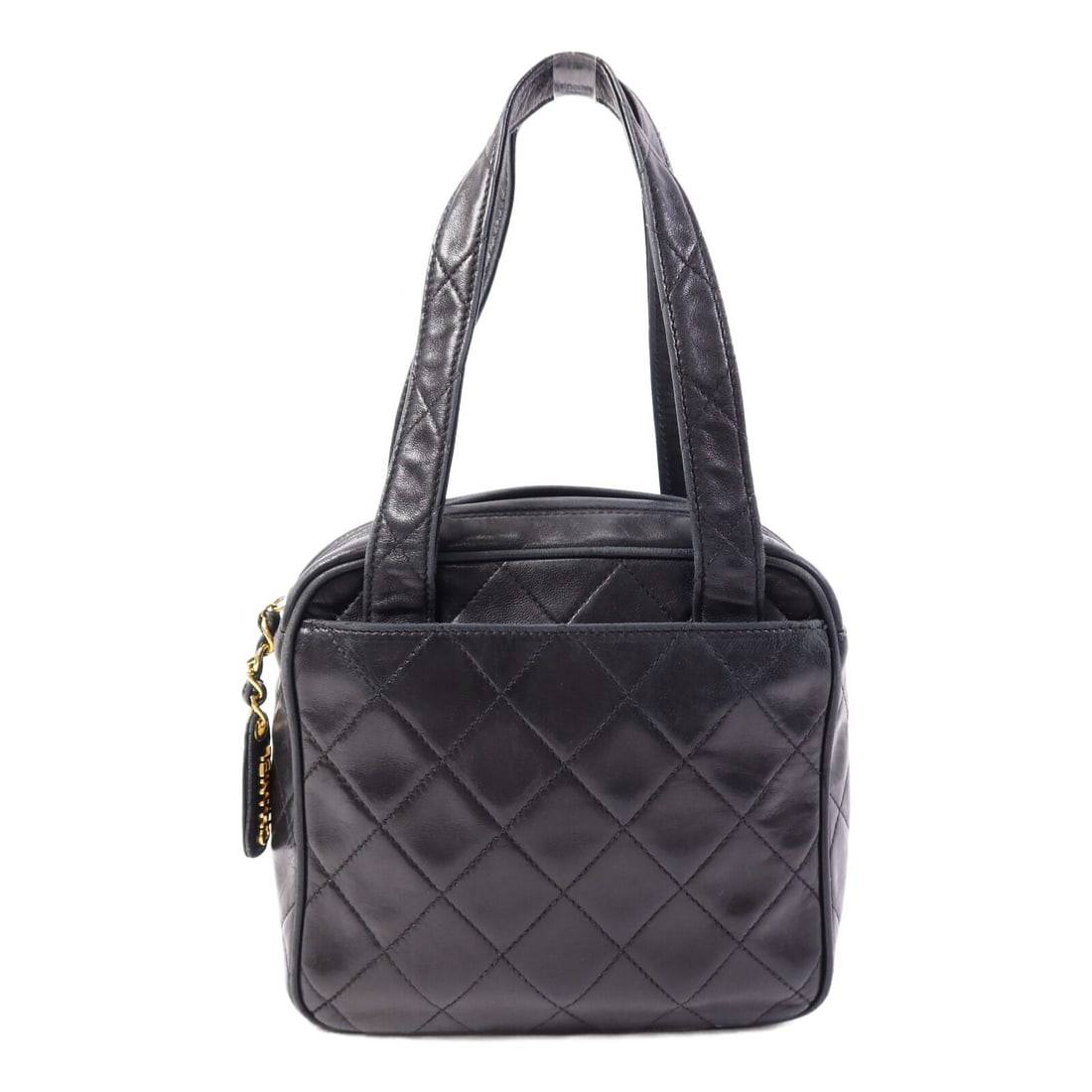 CHANEL Black Lambskin Handbag with CC Gold Hardware: CHANEL Black Lambskin Handbag with CC Gold Hardware This Chanel handbag is crafted from luxurious black lambskin leather and features a classic design. Made in France, it offers a regular size profile