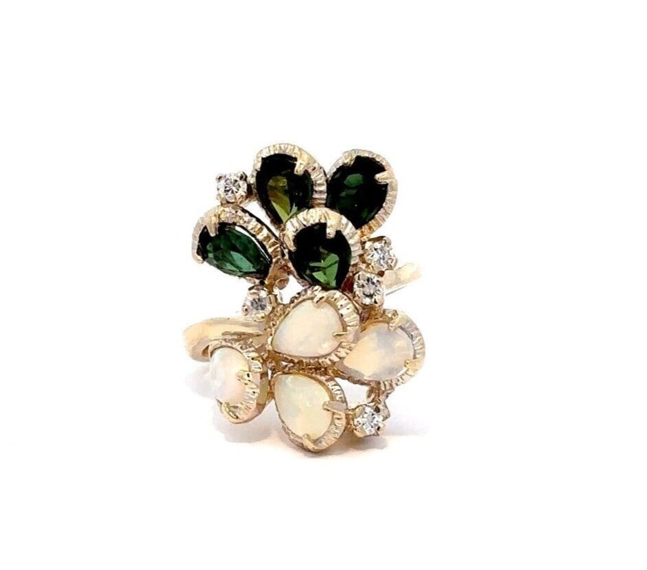 Multicolor Pear Opal Green Tourmaline Yellow Gold Cocktail Ring: Multicolor Pear Opal Green Tourmaline Yellow Gold Cocktail Ring This stunning cocktail ring features a unique floral spray design crafted in solid 13-14K yellow gold. The centerpiece includes five nat