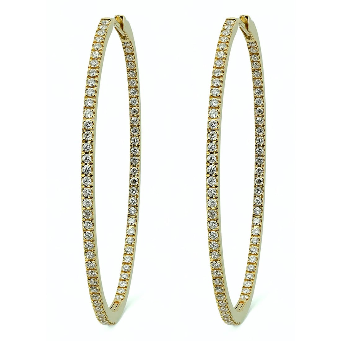18k Yellow Gold Oval Hoop Earrings with Natural Diamonds 1.25ctw by Memoire: 18k Yellow Gold Oval Hoop Earrings with Natural Diamonds 1.25ctw by Memoire These Memoire oval hoop earrings are crafted from 18k yellow gold and feature a pave setting of natural round cut diamonds a