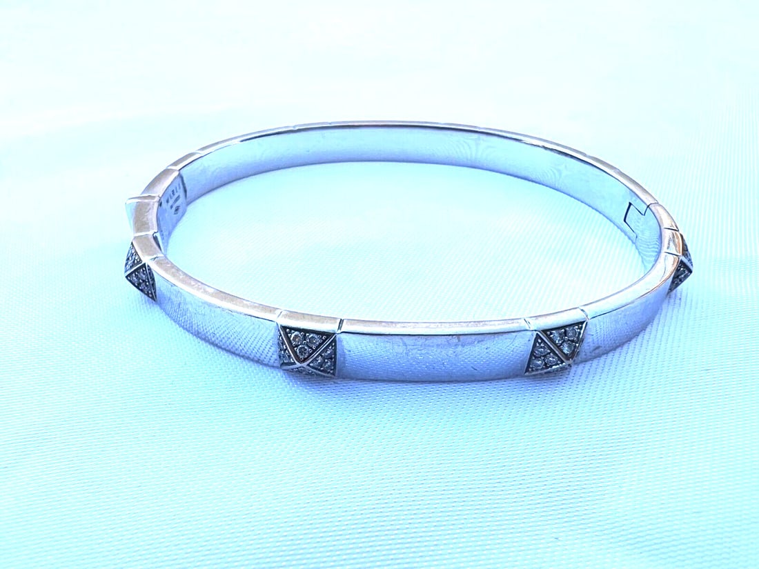 Marli 18K White Gold Cuff Bracelet with Diamonds 0.50ct: Marli 18K White Gold Cuff Bracelet with Diamonds 0.50ct This exquisite Marli 18K white gold diamond bracelet is a stunning cuff style piece crafted in New York. It is fully signed and hallmarked "Marl