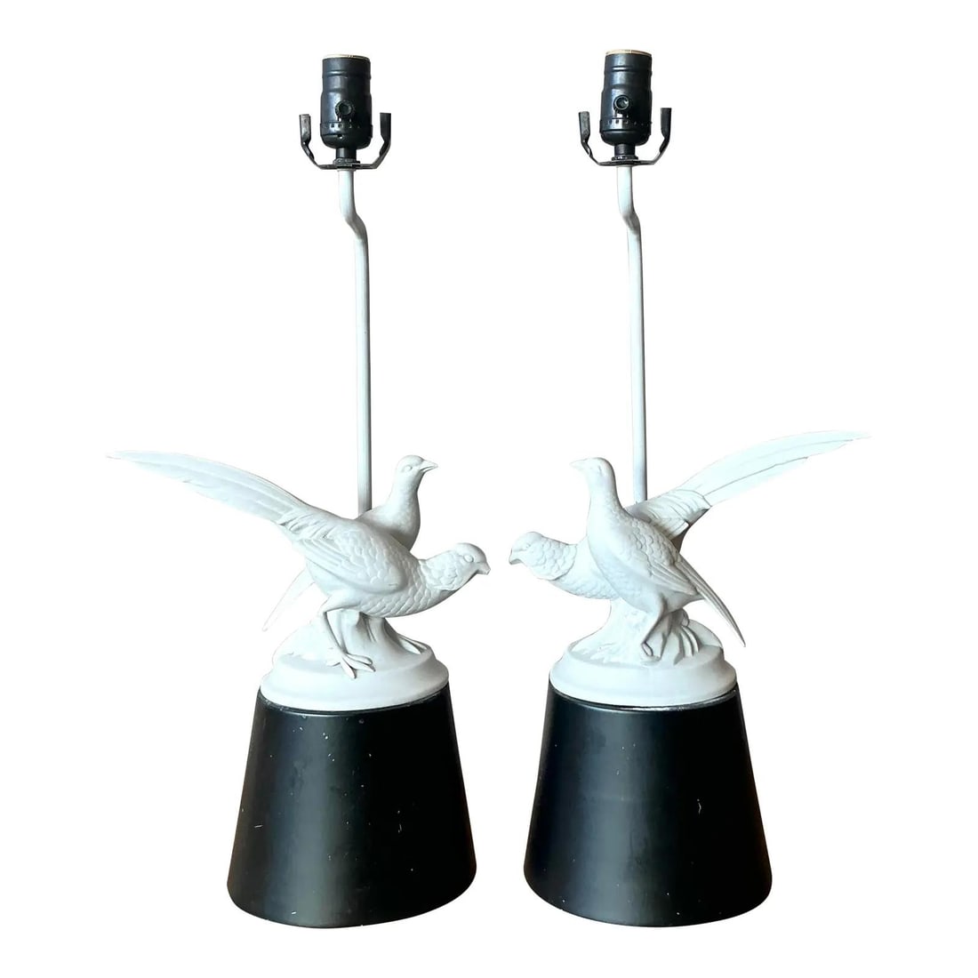 Pair of Bisque Porcelain Pheasant Table Lamps with Black Bases: Pair of Bisque Porcelain Pheasant Table Lamps with Black Bases This pair of vintage Regency table lamps features finely detailed bisque porcelain sculptures of male and female pheasants with fully spr