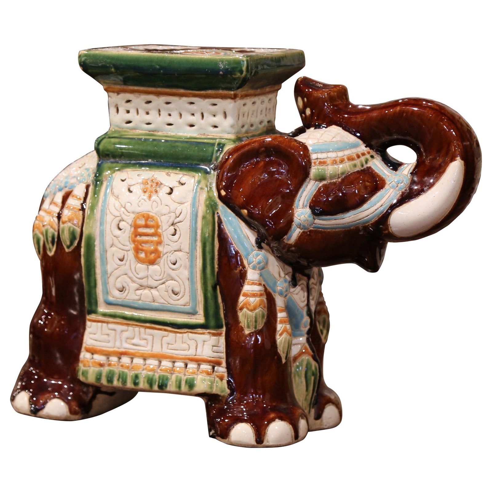 Hand Painted Faience Elephant Motif Ceramic Garden Seat Circa 1960: Hand Painted Faience Elephant Motif Ceramic Garden Seat Circa 1960 This vintage faience garden seat from the mid-20th century is crafted in the shape of an elephant with its trunk raised, a traditiona