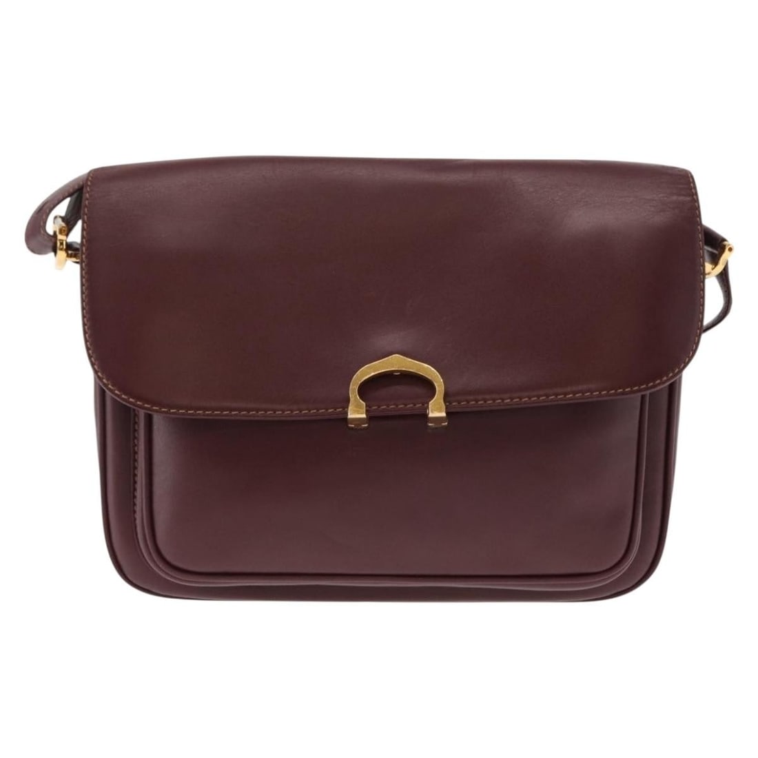 Must de Cartier burgundy leather women's shoulder bag: Must de Cartier burgundy leather women's shoulder bag This pre-owned Must de Cartier shoulder bag is crafted from burgundy leather and designed for women. It features metal fittings and was made in Sp