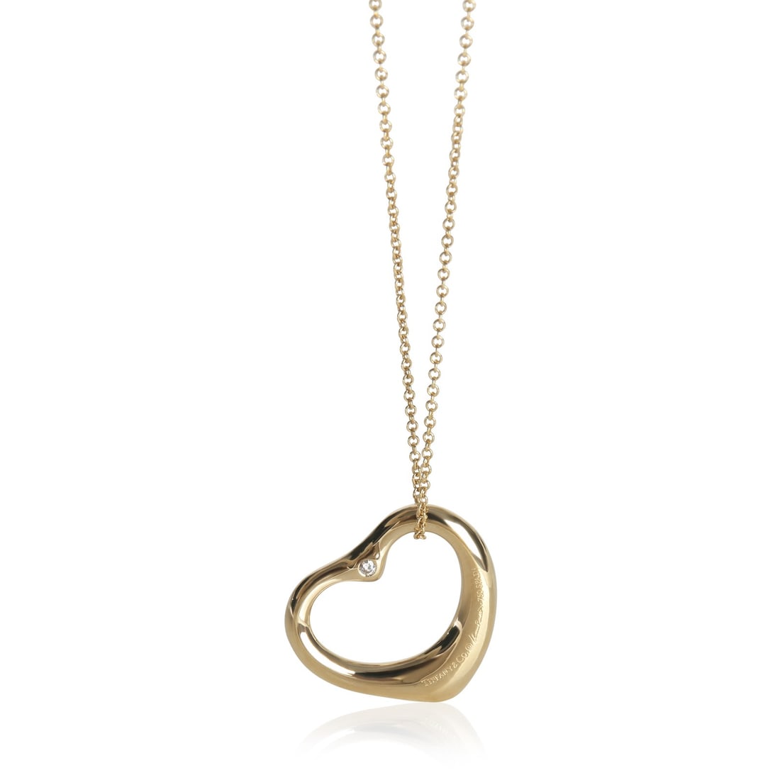 Elsa Peretti Open Heart 18k Yellow Gold Diamond Pendant by Tiffany & Co.: Elsa Peretti Open Heart 18k Yellow Gold Diamond Pendant by Tiffany & Co. This Tiffany & Co. Elsa Peretti Open Heart pendant is crafted from 18k yellow gold and features round brilliant diamonds with a