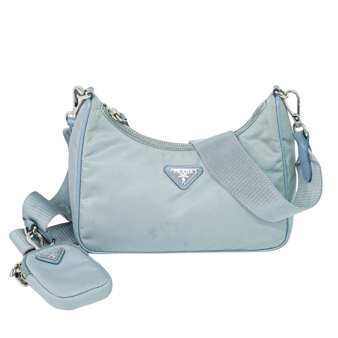 Prada Re-Edition 2005 Blue Nylon Shoulder Bag Italy: Prada Re-Edition 2005 Blue Nylon Shoulder Bag Italy This Prada Re-Edition 2005 Shoulder Bag is crafted from blue nylon and designed for women. Made in Italy, it features a classic silhouette with prac