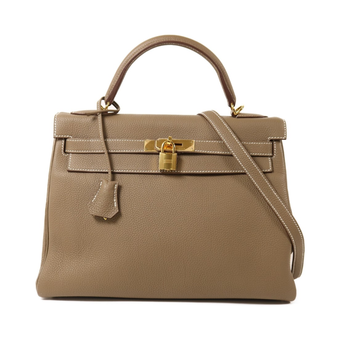 Hermes Kelly 32 Etoupe Togo Leather Shoulder Bag with Gold Hardware: Hermes Kelly 32 Etoupe Togo Leather Shoulder Bag with Gold Hardware This Hermes Kelly 32 is a versatile 2-way shoulder bag crafted from Togo calfskin leather in an elegant gray tone. The bag features