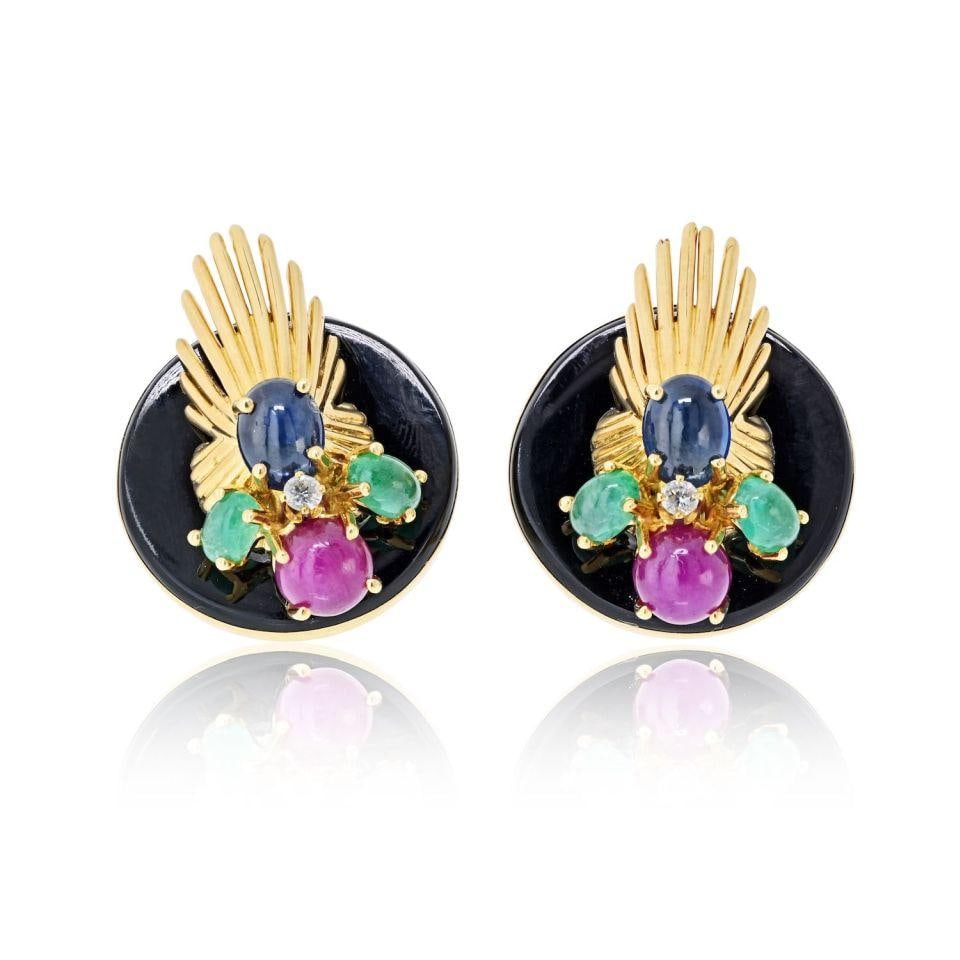 Seaman Schepps Fan Clip Earrings in 18K Gold with Onyx and Gemstone Accents: Seaman Schepps Fan Clip Earrings in 18K Gold with Onyx and Gemstone Accents These Seaman Schepps fan-style clip earrings are crafted in 18K yellow gold and feature a sculptural design. The earrings sh