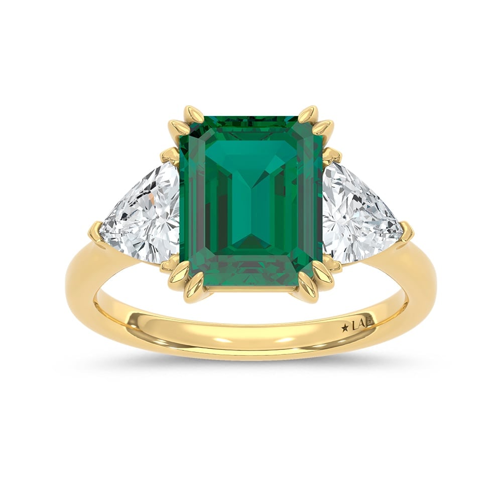 14K Yellow Gold Lab Grown Diamond 4 3/8 Ct.Tw. Emerald Shape Recrystalized Emerald Engagement Ring: 14K Yellow Gold Lab Grown Diamond 4 3/8 Ct.Tw. Emerald Shape Recrystalized Emerald Engagement Ring (Center 3 ct) Celebrate timeless elegance with this 14K yellow gold engagement ring, featuring a radi