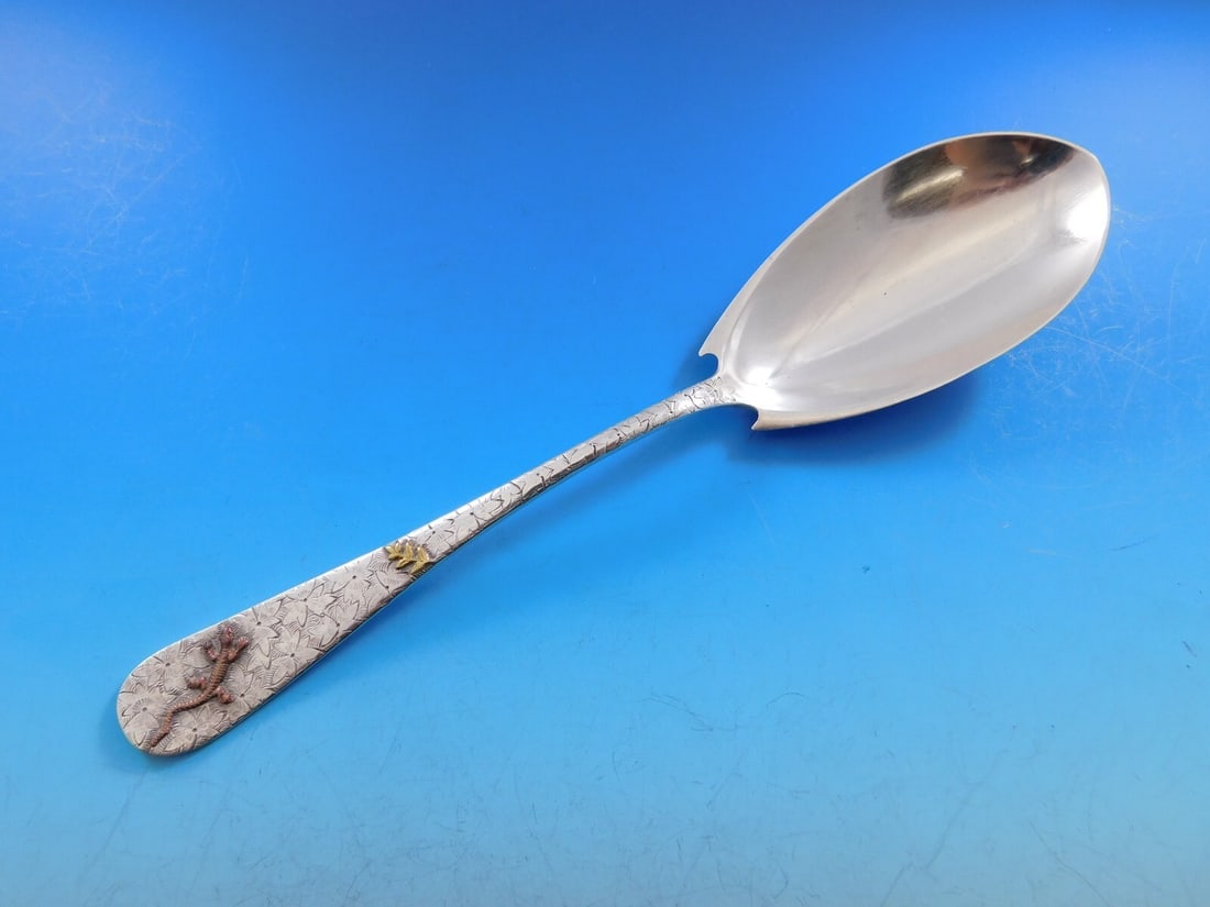 Dominick & Haff Sterling Silver Hammered Berry Spoon with Copper Lizard 8 3/4": Dominick & Haff Sterling Silver Hammered Berry Spoon with Copper Lizard 8 3/4" This exquisite berry spoon by Dominick & Haff showcases a unique hammered and applied design, featuring a detailed copper