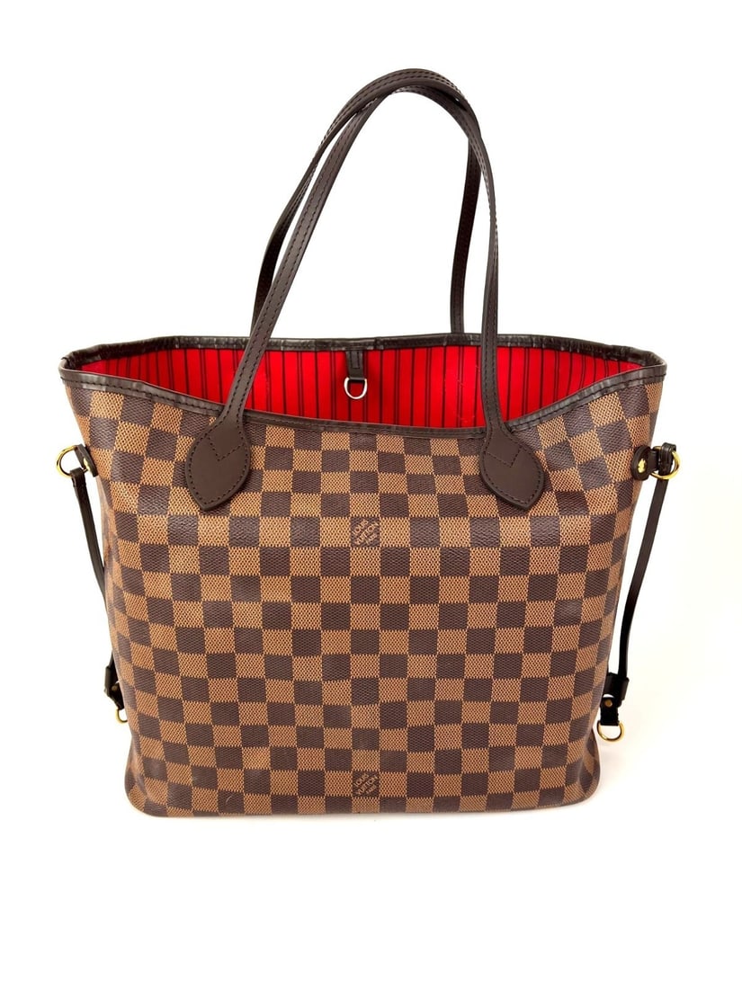 Neverfull MM Tote in Damier Ebene Canvas by Louis Vuitton: Neverfull MM Tote in Damier Ebene Canvas by Louis Vuitton This Louis Vuitton Neverfull MM tote bag features the classic Damier Ebene canvas design with a coated finish. The medium-sized rectangular ba