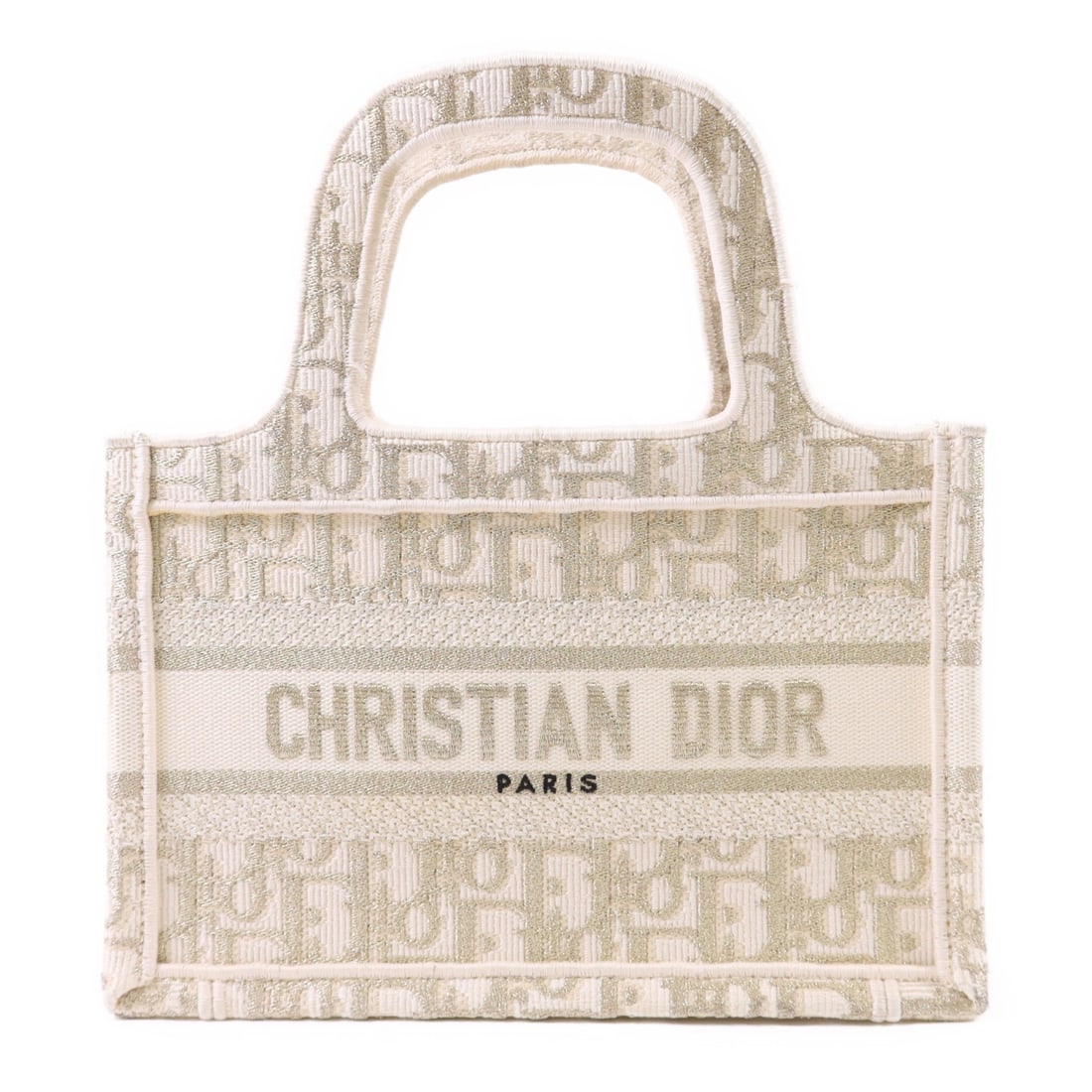 Dior Nano Book Tote White and Gold Canvas Bag: Dior Nano Book Tote White and Gold Canvas Bag This Christian Dior CD Nano Book Tote Bag features a white canvas exterior with gold accents, offering a compact and stylish design. Made in France, the b
