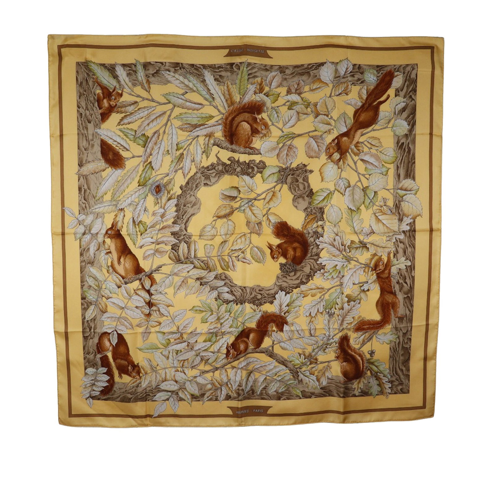 Hermes Casse Noisette Beige 100 Percent Silk Square Scarf 89cm: Hermes Casse Noisette Beige 100 Percent Silk Square Scarf 89cm This Hermes Casse Noisette scarf features a distinctive print on 100% silk in a beige color. Made in France, this accessory is designed i