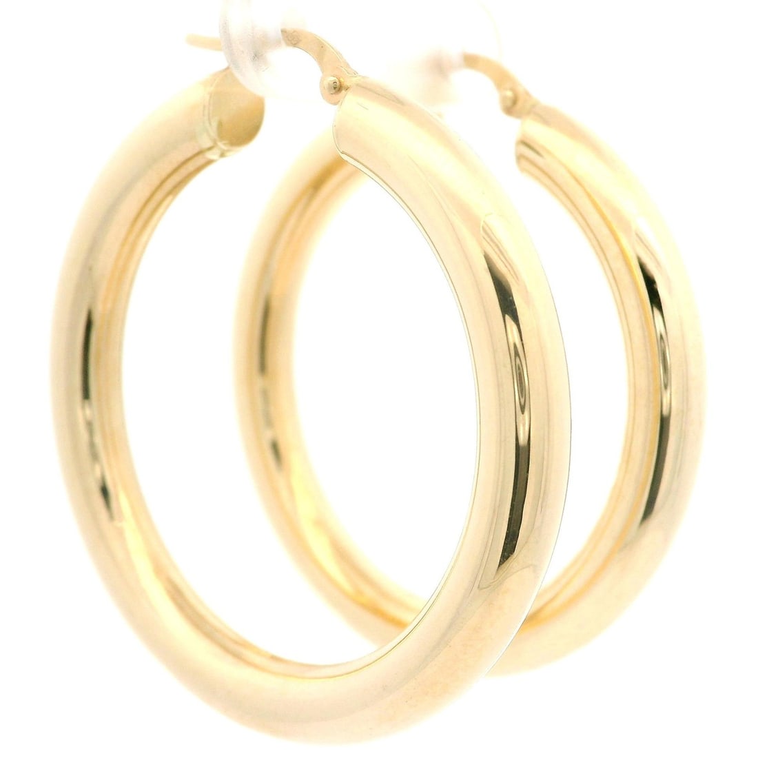 14k Yellow Gold 41mm Classic Large Tube Hoop Earrings: 14k Yellow Gold 41mm Classic Large Tube Hoop Earrings Elevate your style with these classic large tube hoop earrings, crafted from solid 14k yellow gold. Featuring a polished finish, these earrings ar
