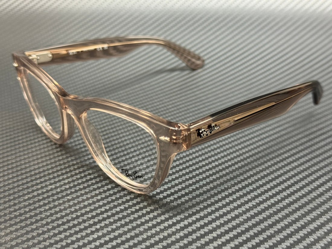 Ray-Ban RX5510 8449 Transparent Brown 52mm Unisex Eyeglasses: Ray-Ban RX5510 8449 Transparent Brown 52mm Unisex Eyeglasses Experience style and comfort with these Ray-Ban RX5510 8449 eyeglasses. Featuring a sleek transparent brown frame, these unisex glasses are