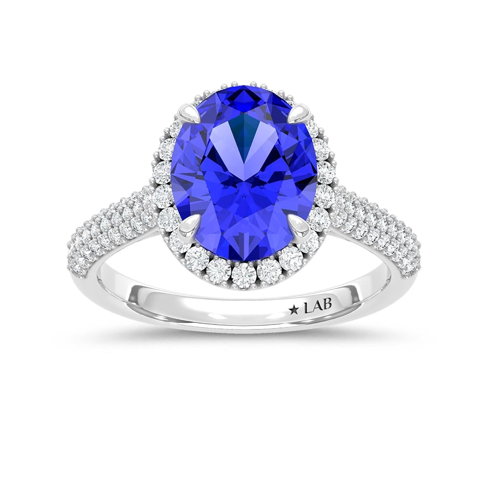 14K White Gold Lab Grown Diamond 4 1/5 Ct.Tw. Oval Shape Recrystalized Blue Sapphire Engagement Ring: 14K White Gold Lab Grown Diamond 4 1/5 Ct.Tw. Oval Shape Recrystalized Blue Sapphire Engagement Ring (Center 3 7/8 ct) Make an unforgettable statement with this magnificent 14K White Gold Engagement R