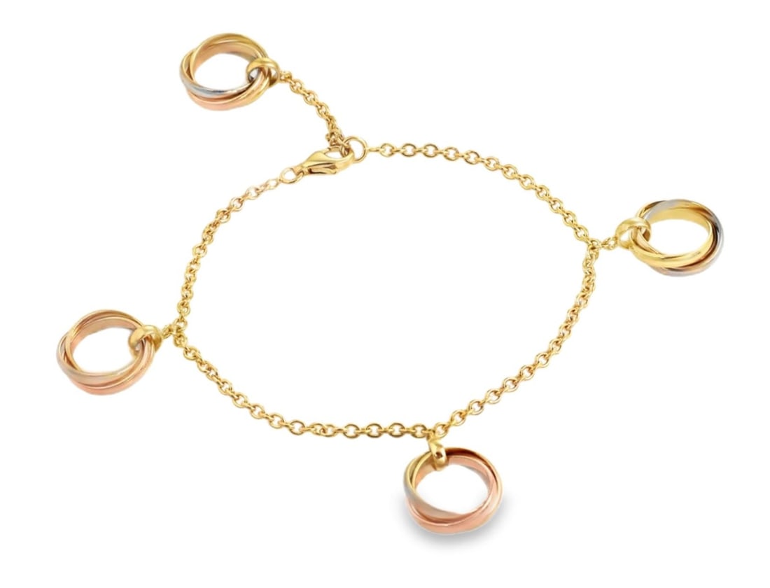 Four Charm Trinity Bracelet in 18k Tricolor Gold with Cartier Certificate: Four Charm Trinity Bracelet in 18k Tricolor Gold with Cartier Certificate This Cartier Trinity bracelet is crafted from 18k tricolor gold, featuring four rolling charms in yellow, pink, and white gold