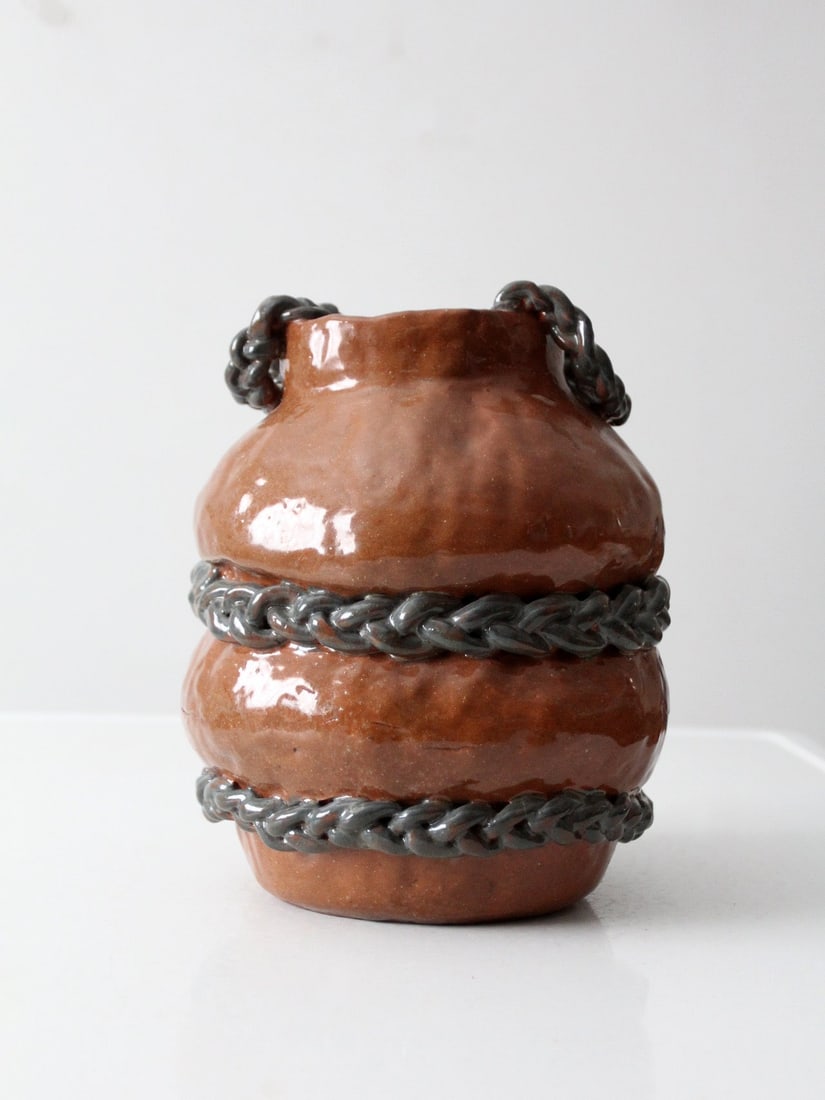 Handmade Sculptural Pottery Vase With Chain Accents and Looped Handles: Handmade Sculptural Pottery Vase With Chain Accents and Looped Handles This vintage handmade studio pottery vase showcases a rounded, sculptural silhouette adorned with applied chain detailing and loo