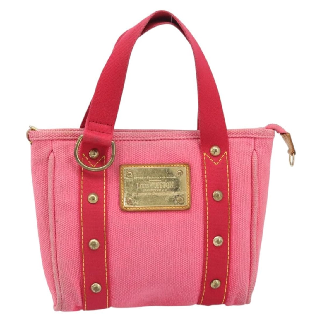 Louis Vuitton Antigua Pink Canvas Tote Bag 23cm: Louis Vuitton Antigua Pink Canvas Tote Bag 23cm This Louis Vuitton Antigua Tote is crafted from pink canvas and designed specifically for women. The bag features leather accents and metal fittings. It