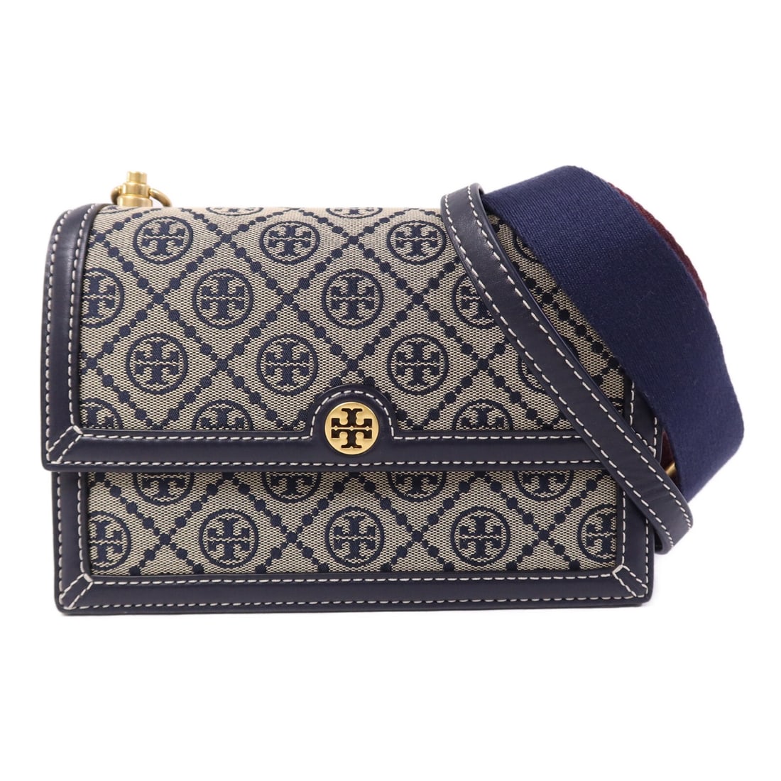 Tory Burch T Monogram Navy Canvas Shoulder Bag with Gold Tone Chain: Tory Burch T Monogram Navy Canvas Shoulder Bag with Gold Tone Chain This Tory Burch T Monogram shoulder bag features a navy canvas exterior and gold hardware, offering a stylish and versatile accessor