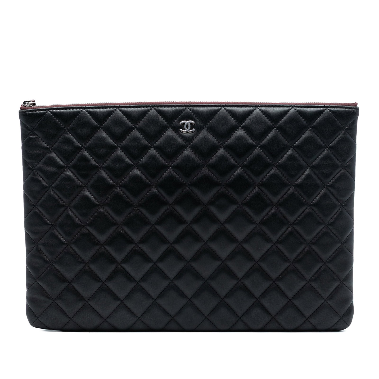 Black Lambskin Quilted Clutch by Chanel Large O Case: Black Lambskin Quilted Clutch by Chanel Large O Case This Chanel Large Quilted Lambskin O Case Clutch features a quilted lambskin leather exterior in black with a top zip closure. Please note signs of