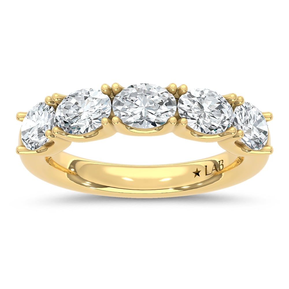 14K Yellow Gold Lab Grown Diamond 2 Ct.Tw. Oval Shape East West Wedding Band: 14K Yellow Gold Lab Grown Diamond 2 Ct.Tw. Oval Shape East West Wedding Band Make a statement with this unique 14K Yellow gold wedding band, featuring 2 carats total weight of lab-grown diamonds set i