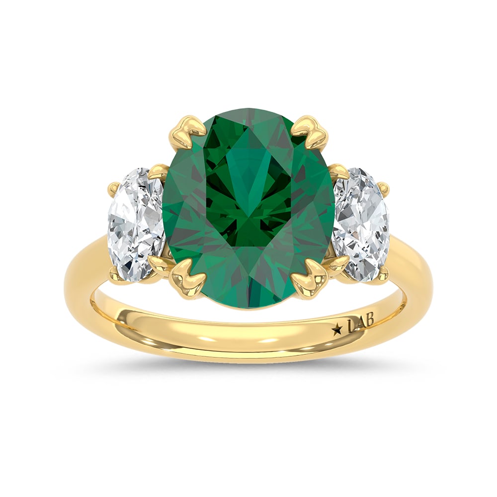 14K Yellow Gold Lab Grown Diamond 4 3/8 Ct.Tw. Oval Shape Recrystalized Emerald Engagement Ring: 14K Yellow Gold Lab Grown Diamond 4 3/8 Ct.Tw. Oval Shape Recrystalized Emerald Engagement Ring (Center 3 3/8 ct) Celebrate timeless elegance with this 14K yellow gold engagement ring. Its centerpiece