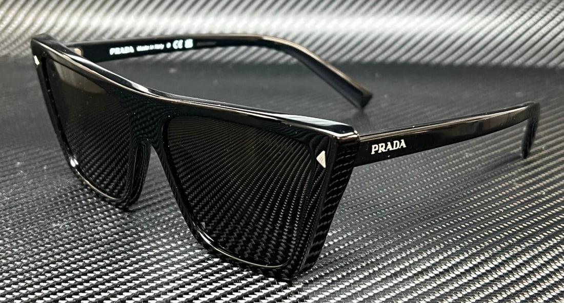Women's PR 21ZS 1AB5S0 Black Sunglasses with Dark Grey Lenses by Prada: Women's PR 21ZS 1AB5S0 Black Sunglasses with Dark Grey Lenses by Prada These PRADA PR 21ZS 1AB5S0 women's sunglasses feature a black frame paired with dark grey lenses for a sophisticated look. The su