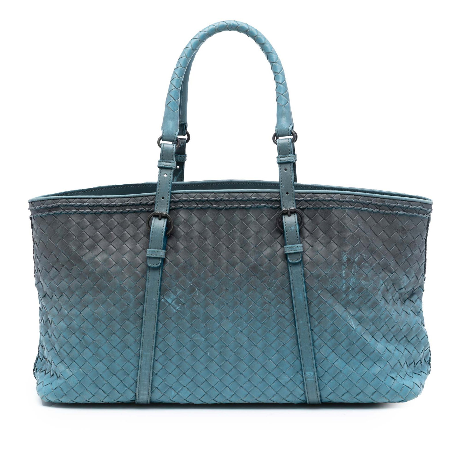 Blue Leather Tote Bag by Bottega Veneta Ombre Intrecciato: Blue Leather Tote Bag by Bottega Veneta Ombre Intrecciato This tote bag features a woven nappa leather design with rolled leather straps and an open top. It includes an interior center zip compartment