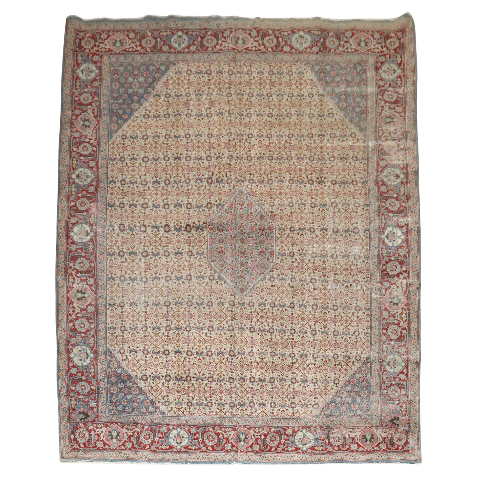 Antique Tabriz Wool Rug Early 20th Century 9'6 x 13'6: Antique Tabriz Wool Rug Early 20th Century 9'6 x 13'6 This stunning early 20th century Persian Tabriz rug features a charming small light blue central medallion set against a herati design wheat groun