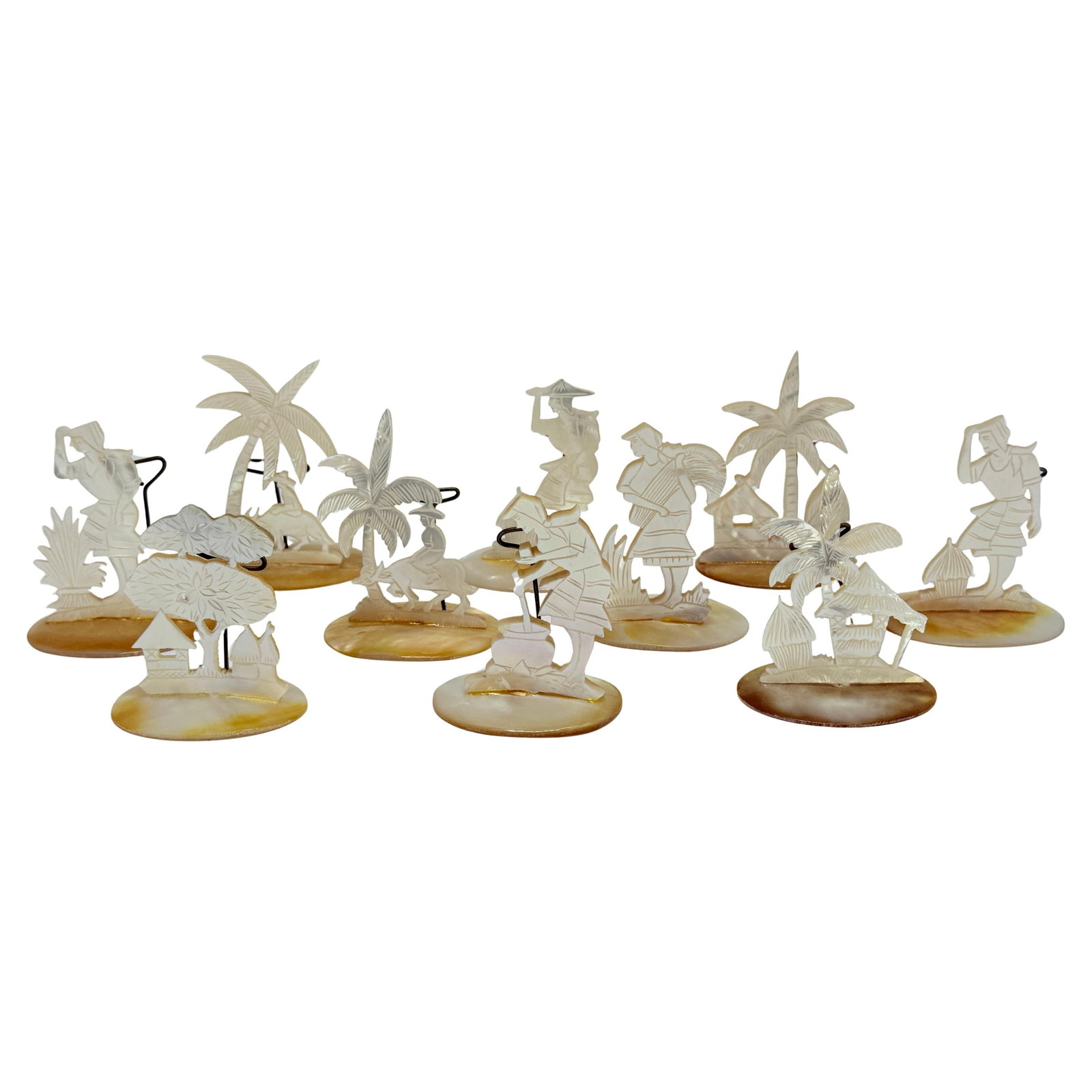 Set of 10 Tribal Carved Mother-of-Pearl Tropical Place Card Holders: Set of 10 Tribal Carved Mother-of-Pearl Tropical Place Card Holders Introducing a charming set of ten intricately carved tropical figural place card holders, each crafted from iridescent mother-of-pea