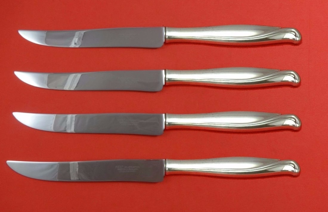 Alvin Spring Bud Sterling Silver Steak Knife Set 4pc Texas Size: Alvin Spring Bud Sterling Silver Steak Knife Set 4pc Texas Size Elevate your dining experience with this stunning 4-piece steak knife set from Alvin, crafted in sterling silver. Designed in the elegan