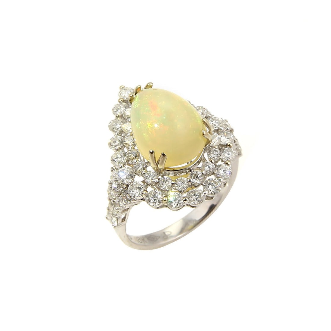 Pear Opal and Diamond 18k White Gold Vintage Cocktail Ring Size 6.5: Pear Opal and Diamond 18k White Gold Vintage Cocktail Ring Size 6.5 This vintage cocktail ring is crafted from solid 18k white gold and features a unique pear-shaped opal of approximately 5.50ct, acce
