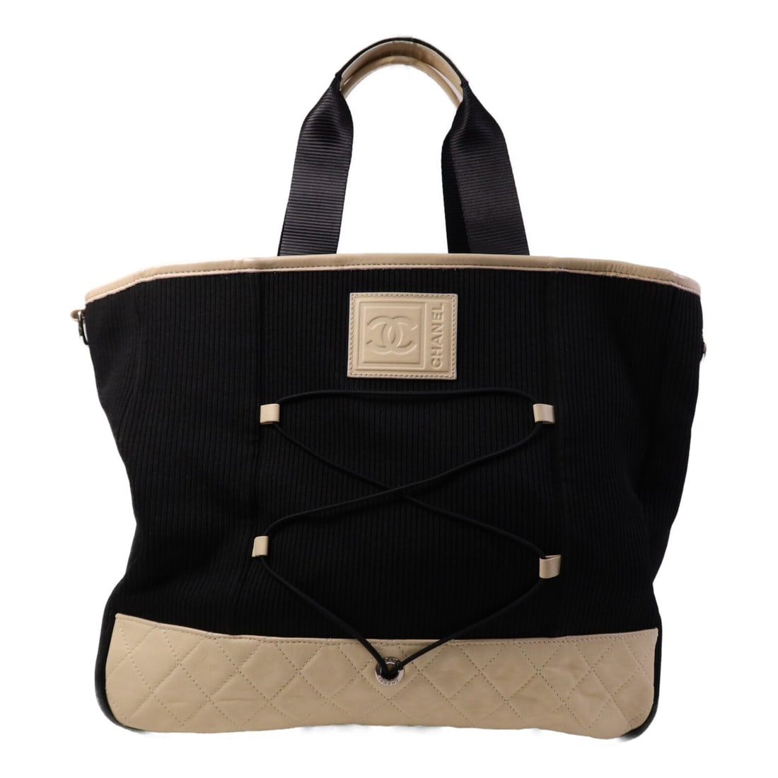 Chanel Calfskin and Canvas Black Tote with Silver CC Hardware: Chanel Calfskin and Canvas Black Tote with Silver CC Hardware This CHANEL tote bag features a combination of calfskin leather and canvas in black and beige. Designed in a regular size, it offers both