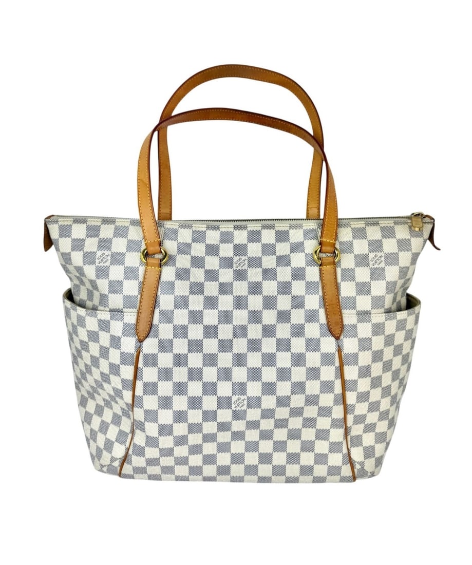 Totally GM Shoulder Bag in Damier Azur Canvas by Louis Vuitton: Totally GM Shoulder Bag in Damier Azur Canvas by Louis Vuitton This Louis Vuitton Totally GM tote features the iconic Damier Azur coated canvas in a trapezoid silhouette. It is designed with beige dou