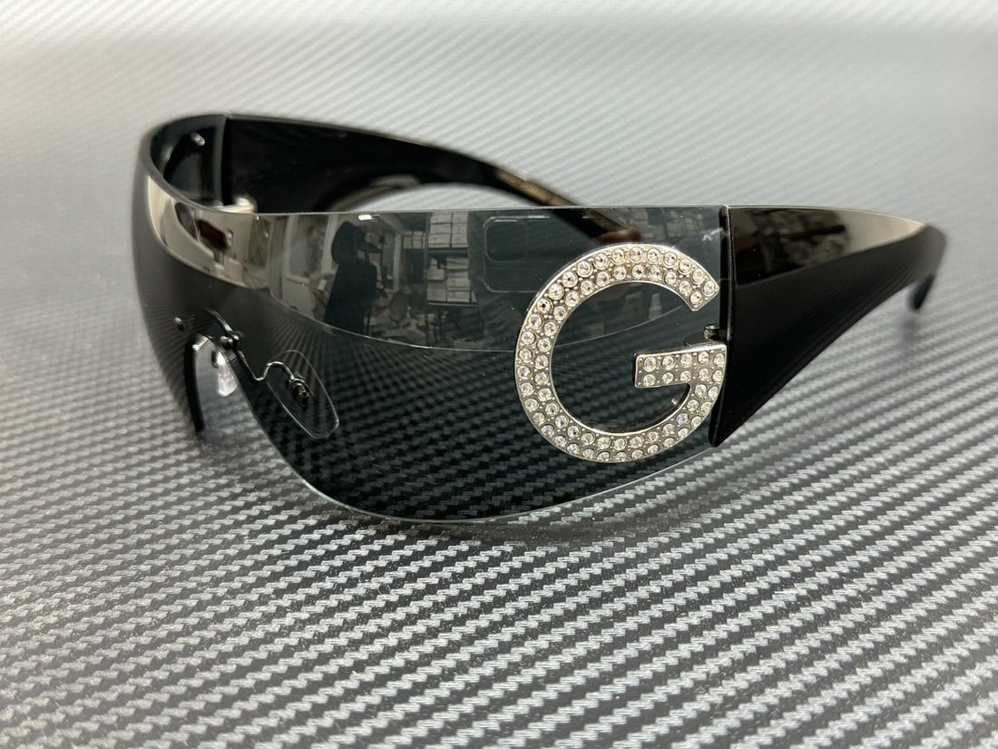 Dolce & Gabbana DG2298B 05 87 Women's Sunglasses Black Frame Dark Grey Lenses: Dolce & Gabbana DG2298B 05 87 Women's Sunglasses Black Frame Dark Grey Lenses Elevate your style with these women's sunglasses from Dolce & Gabbana. Featuring a sleek black frame and dark grey lenses,