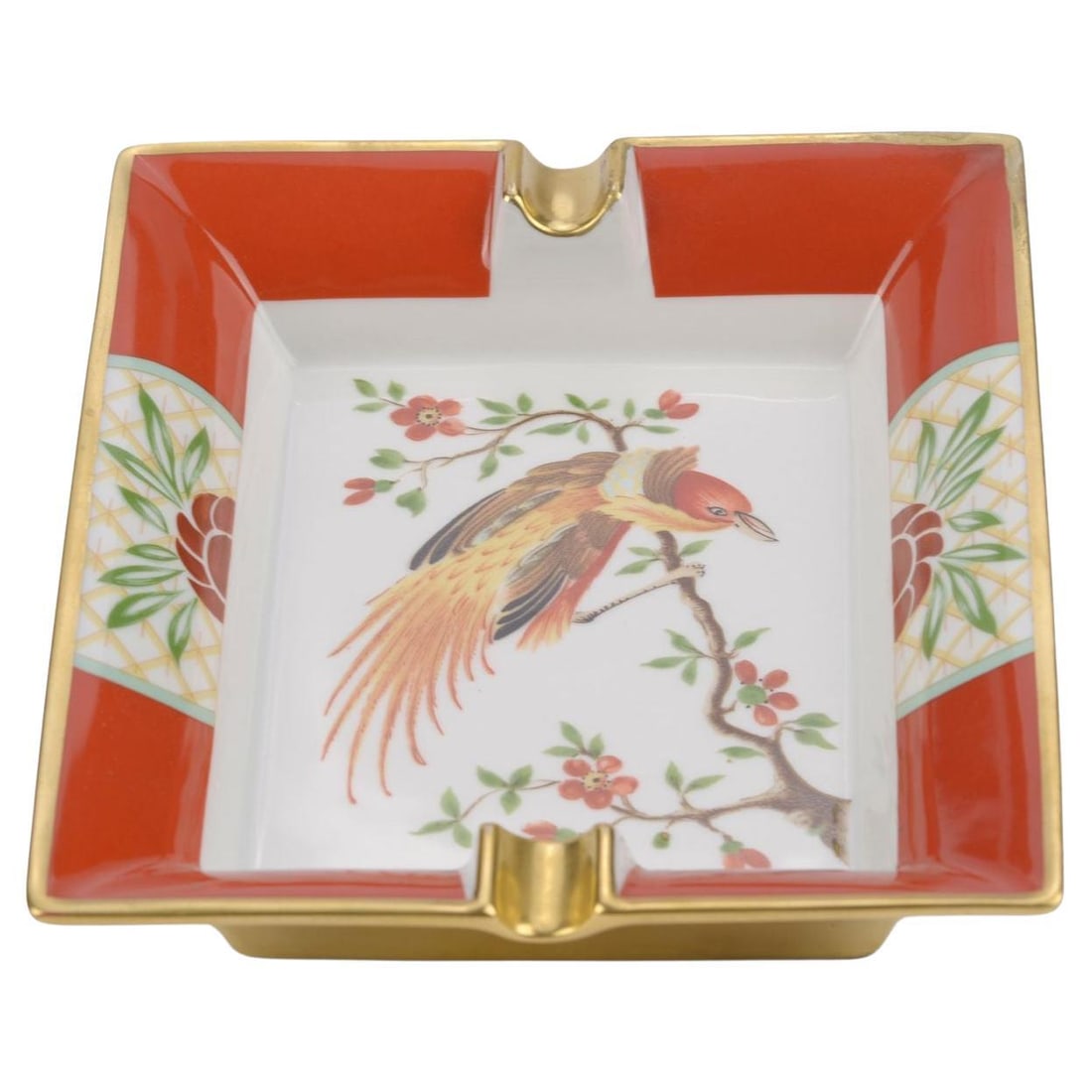 Hermes Vintage Exotic Bird Porcelain Ashtray Red France 1980s: Hermes Vintage Exotic Bird Porcelain Ashtray Red France 1980s This exquisite Hermes vintage ashtray showcases a vibrant red porcelain design, featuring an elegant depiction of an exotic bird perched o