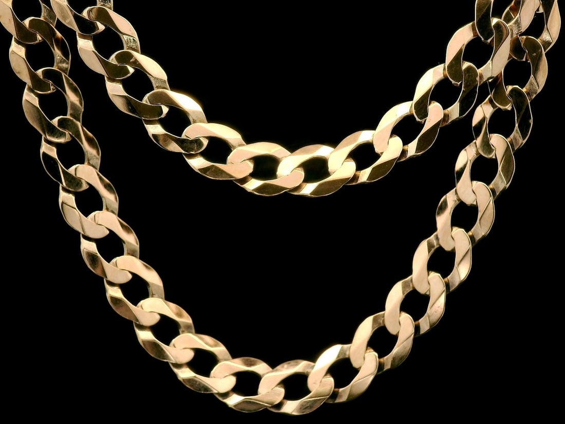 Italian 10k Rosy Yellow Gold 23 Flat Curb Cuban Link Necklace: Italian 10k Rosy Yellow Gold 23 Flat Curb Cuban Link Necklace This exquisite Italian necklace features a stunning 23" Flat Curb Cuban Link design crafted from solid 10k rosy yellow gold. Weighing 20.3